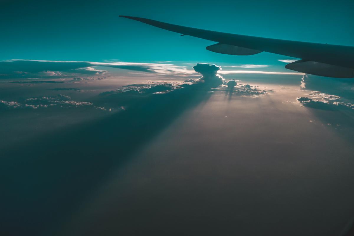 Airplane Above the Clouds