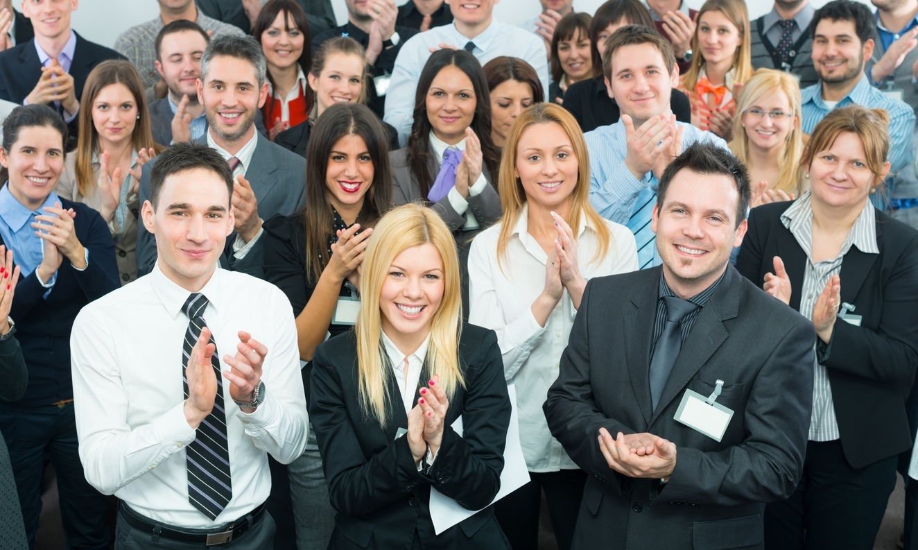 Young Business People Applaud At The Seminar Or Conference.